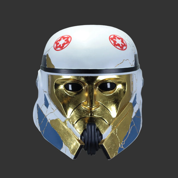 A Star Wars themed cracked white, gold, and blue Imperial stormtrooper helmet, shown against a plain white background.