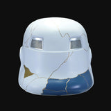 A white and blue decorative helmet with gold crackle-style lines.