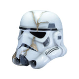 A white Stormtrooper-style helmet with black visor details and decorative gold kintsugi lines